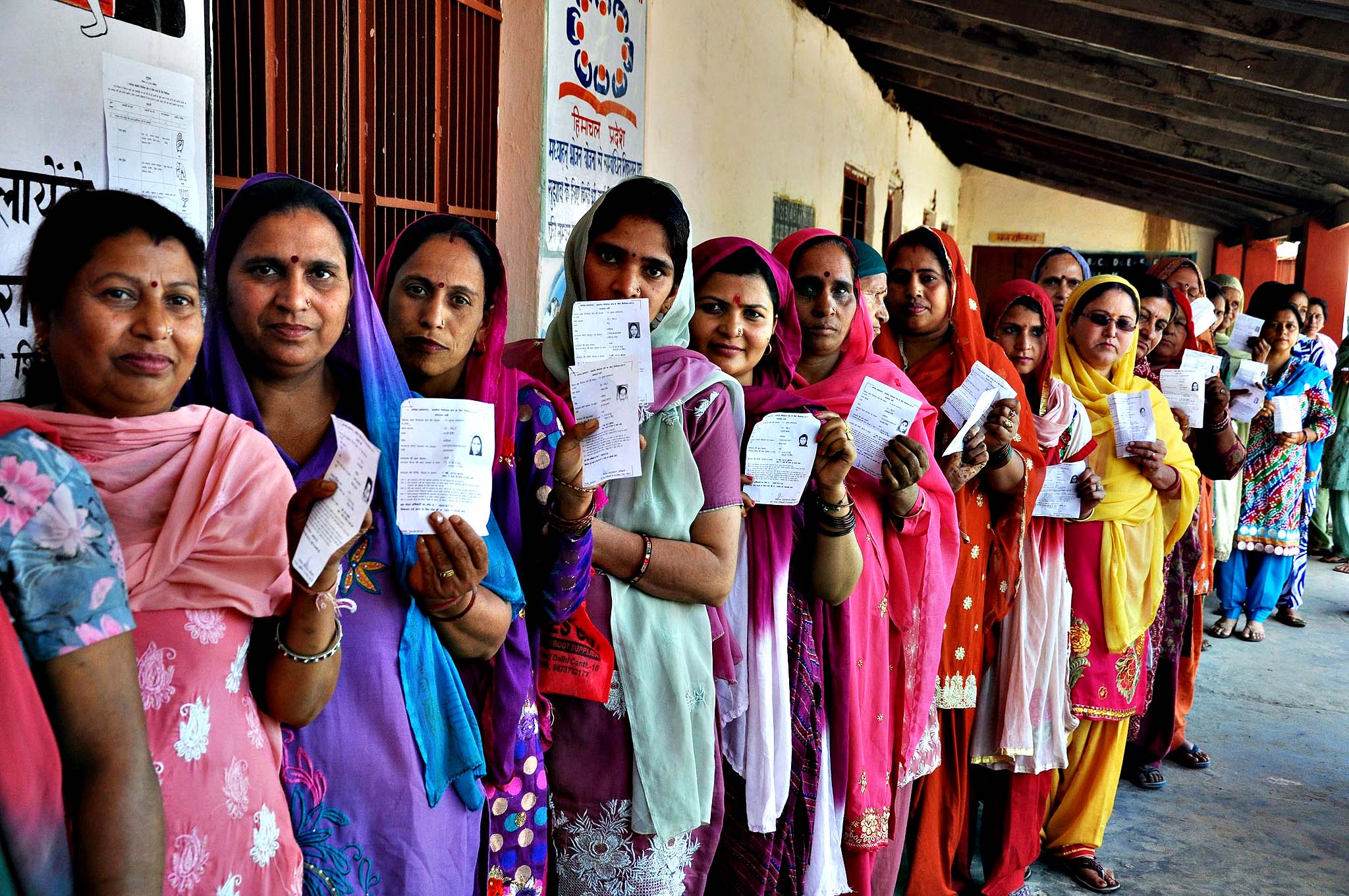 Voting during 8th phase of Parliamentary election...epa04194527 Indian women show their voting slips as they wait to cast their votes at a polling station during the 8th phase of Parliamentary election at Palampur, Himachal Pradesh, India, 07 May 2014. Parliamentary elections in India are being held in nine phases between 07 April and 12 May 2014. A total of 814.6 million people are eligible to vote, around 100 million more than in the elections in 2009. EPA/SANJAY BAID