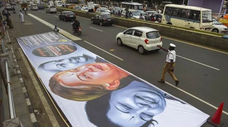 Chennai: Workers prepare a huge hoarding for the second death anniversary of the late J Jayalalithaa in Chennai, Tuesday, Dec. 4, 2018. The Tamil Nadu government is expected to announce a series of programmes to mark the occasion. (PTI Photo/R Senthil Kumar) (PTI12_4_2018_000171A)