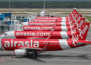 AirAsia planes are seen parked at Kuala Lumpur International Airport 2, during the movement control order due to the outbreak of the coronavirus disease (COVID-19), in Sepang, Malaysia April 14, 2020. REUTERS/Lim Huey Teng