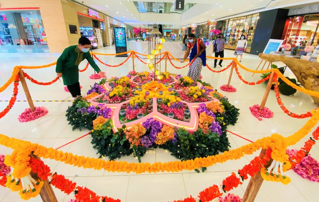 Capture illuminating Insta worthy pictures with friends and family featuring Da Men Malls Light of Rangoli decorations