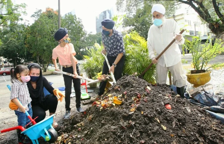 Photos of Me Jaspal and members of the Sikh community who are involved in turning organic fertilizer at Sentul Gudwara. —AZMAN GHANI/The Star