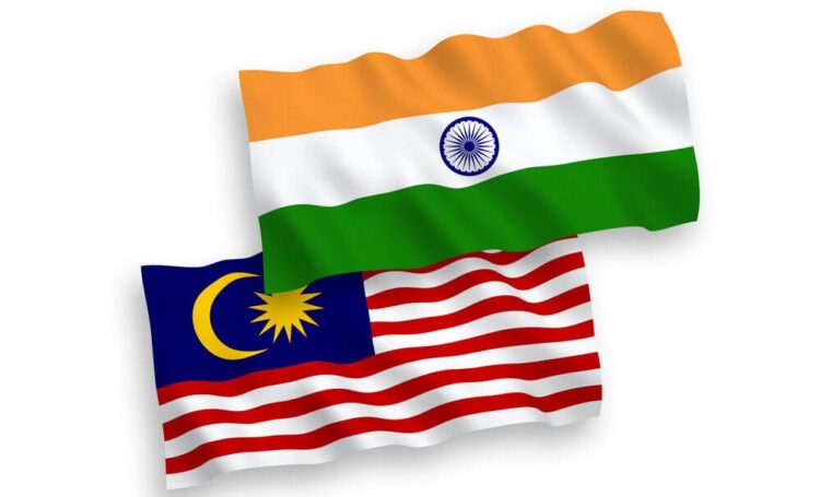 National vector fabric wave flags of India and Malaysia isolated on white background. 1 to 2 proportion.