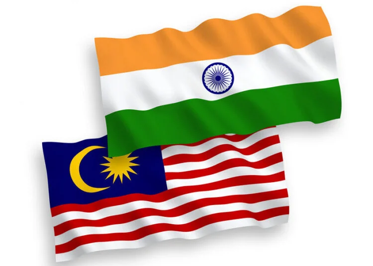 National vector fabric wave flags of India and Malaysia isolated on white background. 1 to 2 proportion.