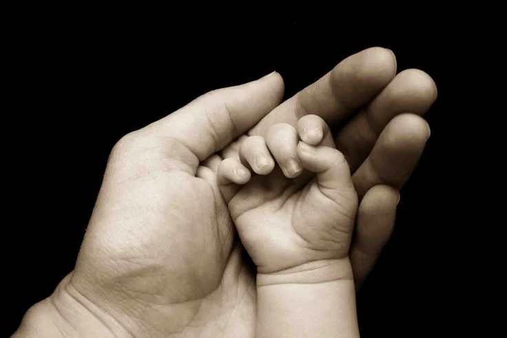Mom & baby's hand